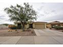 Attractive single-story home with desert landscaping and an attached two-car garage at 18550 W Mcneil St, Goodyear, AZ 85338