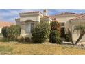 Attractive home featuring a tile roof, chimney, and well-maintained landscaping at 2127 W Peninsula Cir, Chandler, AZ 85248