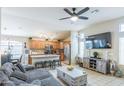 Spacious living room with adjacent kitchen features modern furnishings and a cozy, inviting atmosphere at 2725 E Mine Creek Rd # 1208, Phoenix, AZ 85024