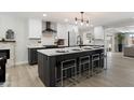 Stylish kitchen with a large island, modern appliances, sleek cabinetry, and ample counter space at 2802 E Mercer Ln, Phoenix, AZ 85028