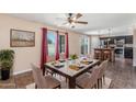 Elegant dining room with pool views, perfect for entertaining at 4114 E Muirwood Dr, Phoenix, AZ 85048