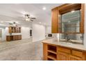 Spacious living room with a wet bar, fireplace, and carpeted floor at 5200 S Lakeshore Dr # 206, Tempe, AZ 85283