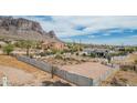 Wide view of the backyard showing a fenced in boundary and mountain views at 5670 E Singletree St, Apache Junction, AZ 85119
