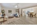 Bright, open-concept living area with tile floors and views into the dining and kitchen at 5808 E Brown Rd # 49, Mesa, AZ 85205