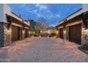 Estate motor court with spacious garages and charming stone and stucco architecture at 6102 E Sage Dr, Paradise Valley, AZ 85253