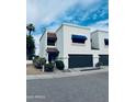 Charming two-story townhouse with a private garage, manicured landscaping, and inviting curb appeal at 727 W Maryland Ave # 1, Phoenix, AZ 85013