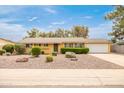 Charming single-story home featuring a well-manicured front yard and a two-car garage at 7307 N 17Th Ave, Phoenix, AZ 85021
