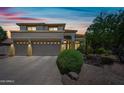 Beautiful two-story home features a two car garage and desert landscaping at 7342 E Norwood St, Mesa, AZ 85207