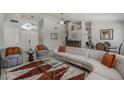Bright living room boasts tile floors, vaulted ceiling, and a modern chandelier at 1461 W Tara Dr, Gilbert, AZ 85233