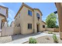 Beautiful stucco two-story home boasts a low-maintenance yard and charming architecture at 14881 W Ashland Ave, Goodyear, AZ 85395