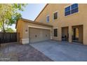 Spacious three-car garage and outdoor patio area perfect for entertaining in Arizona at 16206 W Cocopah St, Goodyear, AZ 85338