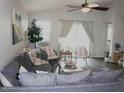 Bright living room with comfortable seating, natural light and view of the backyard at 18599 W Illini St, Goodyear, AZ 85338