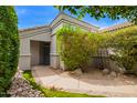 Inviting front entryway with desert landscaping and a covered porch at 19606 N 23Rd Way, Phoenix, AZ 85024