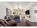 Comfortable living room with a large sectional sofa and a sliding glass door at 19606 N 23Rd Way, Phoenix, AZ 85024