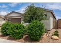 Exterior showcasing desert landscaping, rock mulch and a charming single-story facade at 22568 E Rosa Rd, Queen Creek, AZ 85142