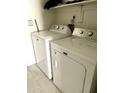 Functional laundry area featuring a white washer and dryer for convenient chores at 7013 W North Ln, Peoria, AZ 85345