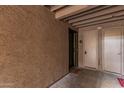 Condo entrance with neutral walls and updated flooring, adjacent to the utility closet at 7777 E Main St # 143, Scottsdale, AZ 85251