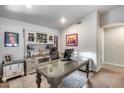 Well-lit office featuring custom cabinetry and desk, plus decor at 8738 W Runion Dr, Peoria, AZ 85382