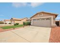 Charming single-Gathering home featuring a spacious driveway, manicured lawn, and inviting curb appeal at 10521 W Ross Ave, Peoria, AZ 85382