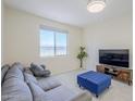 Cozy living room with large windows, neutral paint, comfortable seating and tile floors at 1335 E June St # 107, Mesa, AZ 85203