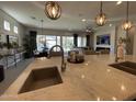 Spacious kitchen with stainless steel appliances, large island and open floor plan perfect for entertaining at 15801 W Cielo Grande Ave, Surprise, AZ 85387