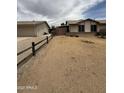 Wide shot of home, detached garage, and fenced in backyard at 1804 W Kristal Way, Phoenix, AZ 85027