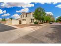 Street view of home highlighting side yard, neutral color scheme, landscaping and well-maintained surroundings at 1912 S Colt Dr, Gilbert, AZ 85295