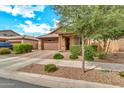 Charming single-Gathering home featuring a low maintenance front yard, two car garage, and desert landscaping at 21667 S 225Th Way, Queen Creek, AZ 85142