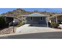 Charming single-level home featuring desert landscaping and covered parking space with disability access at 2233 E Behrend Dr # 203, Phoenix, AZ 85024