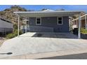 Charming single-level home featuring desert landscaping and covered parking space with disability access at 2233 E Behrend Dr # 203, Phoenix, AZ 85024