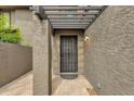 The front entrance to this home featuring a pergola for shade and a security door at 2338 W Lindner Ave # 52, Mesa, AZ 85202