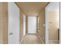 Entry way with neutral paint, ceramic tile floors, and coat closet for storage at 2338 W Lindner Ave # 52, Mesa, AZ 85202