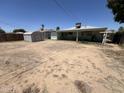Spacious backyard with ample potential for creating an outdoor oasis and includes a storage shed at 2937 W Marshall Ave, Phoenix, AZ 85017