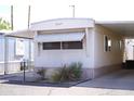 Home exterior featuring an awning, xeriscaping, and a charming mailbox, perfect for curb appeal at 345 S 58Th St # 10, Mesa, AZ 85206
