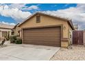 A close up of the garage and the architecture of the home at 3703 S 73Rd Dr, Phoenix, AZ 85043