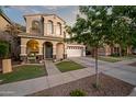 Beautiful two-story home with arched entryway, well-maintained landscaping, and a spacious driveway at 3773 E Stampede Dr, Gilbert, AZ 85297
