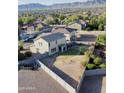 Aerial view of a fenced backyard offering a trampoline with mountain views at 4804 S 25Th Dr, Phoenix, AZ 85041