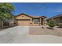 Charming single-story home features a two-car garage and low-maintenance landscaping at 5096 S 245Th Dr, Buckeye, AZ 85326