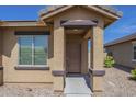 Close up of front porch with decorative pillars and low maintenance landscape at 5096 S 245Th Dr, Buckeye, AZ 85326