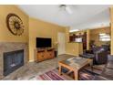 Inviting living room with fireplace, tiled floors and comfortable seating at 5335 E Shea Blvd # 1094, Scottsdale, AZ 85254