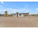 Lovely single-story home with a neutral-colored exterior, covered parking and drought-resistant front yard at 546 N 96Th Pl, Mesa, AZ 85207