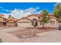 Single-Gathering home with a tile roof, two-car garage, and a nicely landscaped front yard at 845 N Oak Ct, Chandler, AZ 85226