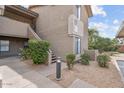 Exterior of a two-story apartment building with stairs, landscaping and unit number 17 at 9600 N 96Th St # 263, Scottsdale, AZ 85258