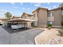 Exterior of an apartment building featuring covered parking, landscaped grounds, and unit number 17 at 9600 N 96Th St # 263, Scottsdale, AZ 85258