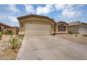 Charming single-story home with a two-car garage, desert landscaping, and a welcoming entrance at 10226 W Country Club Trl, Peoria, AZ 85383