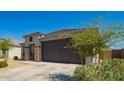Attractive single-story home with a low-maintenance front yard and a two-car garage at 24627 W Ripple Rd, Buckeye, AZ 85326