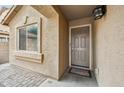 Inviting front entrance with a charming welcome mat, and stone-paver walkway at 4587 E Silverbell Rd, San Tan Valley, AZ 85143