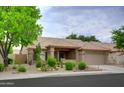 Charming single-story house boasts a well-manicured desert landscape and covered entryway with ample space at 5451 W Folley St, Chandler, AZ 85226