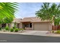 Inviting single-story house showcasing beautiful desert landscaping and an attached two-car garage at 5451 W Folley St, Chandler, AZ 85226