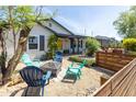 Relaxing front yard seating area with Adirondack chairs and a cozy fire pit at 546 W Cambridge Ave, Phoenix, AZ 85003